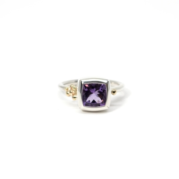 silver ring with bright amethyst in bezel and gold drops